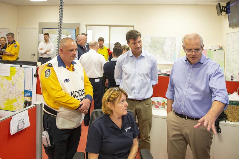 Prime Minister Scott Morrison talks to a volunteer at The Picton Evacuation Centre on December 22, 2019 in Picton, Australia. Getty Images