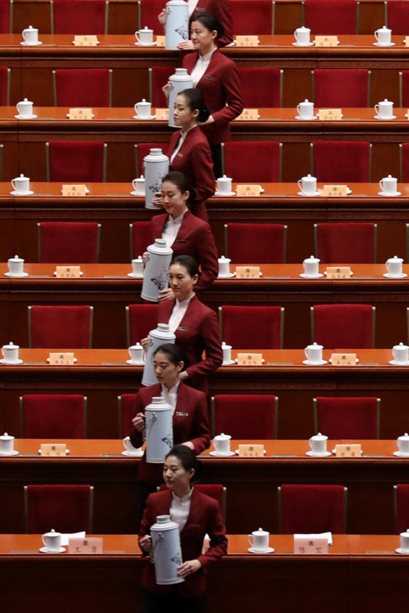 Attendants prepare tea before the opening of the fifth session of the 12th Chinese People’s Political Consultative Conference national committee at the Great Hall of the People in Beijing, China. The CPPCC is the top advisory body of the Chinese political system. Wu Hong / EPA / March 3, 2017