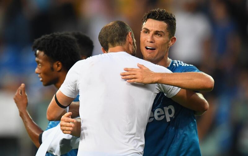 Chiellini celebrates the victory with Ronaldo. Getty