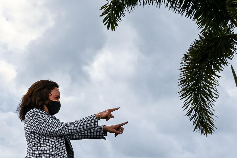 US Democratic vice presidential nominee Kamala Harris gestures to supporters at a drive-in rally in West Palm Beach, Florida. AFP