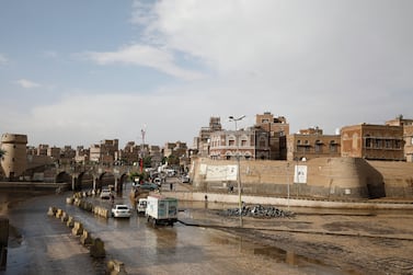 Vehicles drive past old buildings in the old city of Sana'a, Yemen, 22 March 2022.  The Gulf Cooperation Council (GCC) has invited all warring factions in Yemen, including Houthis, for comprehensive talks in the Saudi capital Riyadh at the end of March 2022 to agree to a peace deal aimed at ending a seven-year armed conflict.  Yemen has been in the grip of a power struggle between the Saudi-backed government and the Houthis since late 2014, which sparked a full-blown armed conflict in March 2015 when the Saudi-UAE-led military coalition intervened in the war and launched an airstrike campaign against the Houthis to restore the Yemeni government.   EPA / YAHYA ARHAB