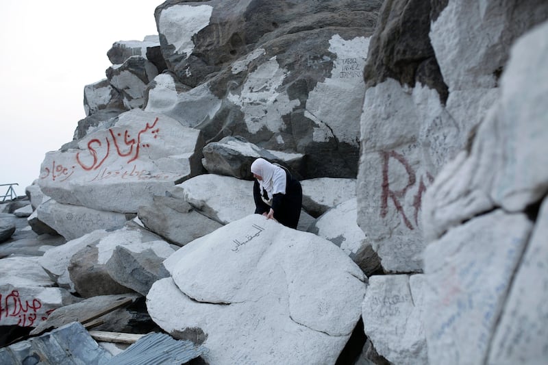 A Muslim woman tries to climb up Mount Al-Noor where the Prophet Mohammed received the first words of the Quran in Mecca, Saudi Arabia. Abir Abdullah