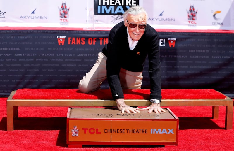 Stan Lee places his handprints in cement during a ceremony in the forecourt of the TCL Chinese theatre in Los Angeles, in 2017. Reuters
