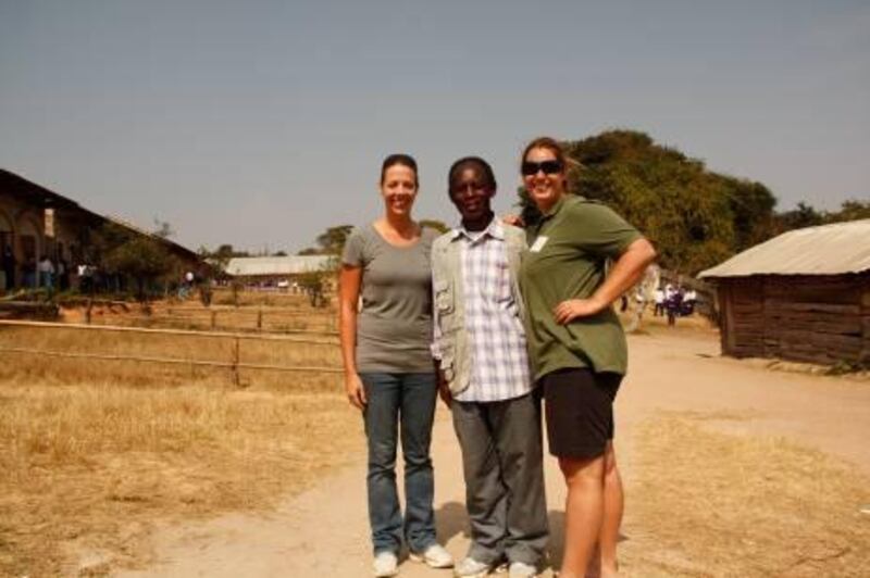 Tamin-Lee (in the shorts), Fr. Massika in the middle and Tamin's friend and colleague Justine Wedge. The picture has been taken in the St Mary's school in Ulete village, 50km outside Iringa city in central Tanzania. 

background:
A teacher at Dubai's Emirates International School, Connolly is travelling to African schools ahead of the arrival of the solar laptops and also identifying other schools that require assistance. She aims to start a teachersÕ voluntary programme and a computer lab at St Mary's school, Tanzania.

Fr. Massika is the founder of the school. 

Courtesy of Tamin-Lee Connolly