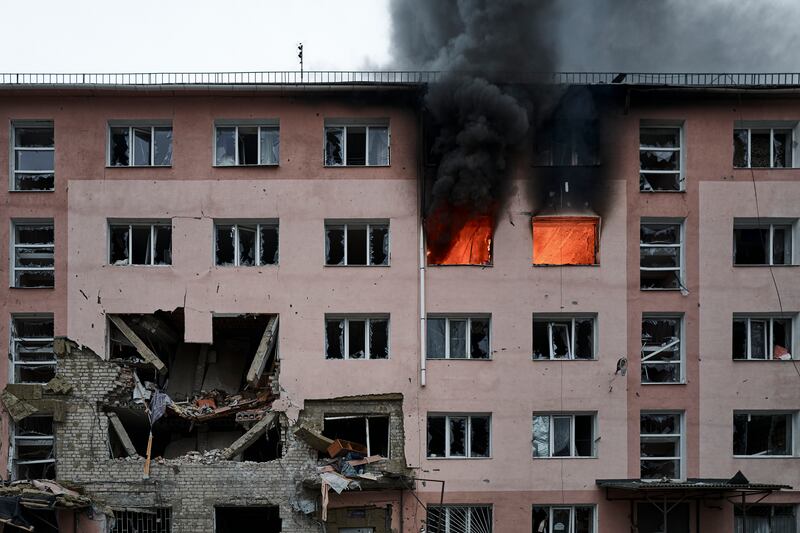Smoke billows from a building on fire after a Russian attack in Bakhmut. AP