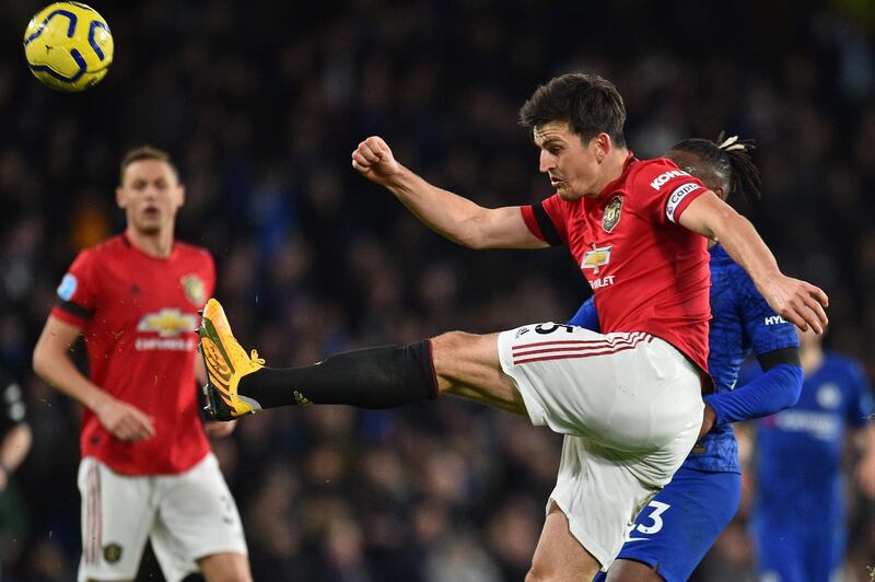 Manchester United's English defender Harry Maguire kicks the ball clear during the English Premier League football match between Chelsea and Manchester United at Stamford Bridge in London on February 17, 2020. RESTRICTED TO EDITORIAL USE. No use with unauthorized audio, video, data, fixture lists, club/league logos or 'live' services. Online in-match use limited to 120 images. An additional 40 images may be used in extra time. No video emulation. Social media in-match use limited to 120 images. An additional 40 images may be used in extra time. No use in betting publications, games or single club/league/player publications.
 / AFP / Glyn KIRK                           / RESTRICTED TO EDITORIAL USE. No use with unauthorized audio, video, data, fixture lists, club/league logos or 'live' services. Online in-match use limited to 120 images. An additional 40 images may be used in extra time. No video emulation. Social media in-match use limited to 120 images. An additional 40 images may be used in extra time. No use in betting publications, games or single club/league/player publications.
