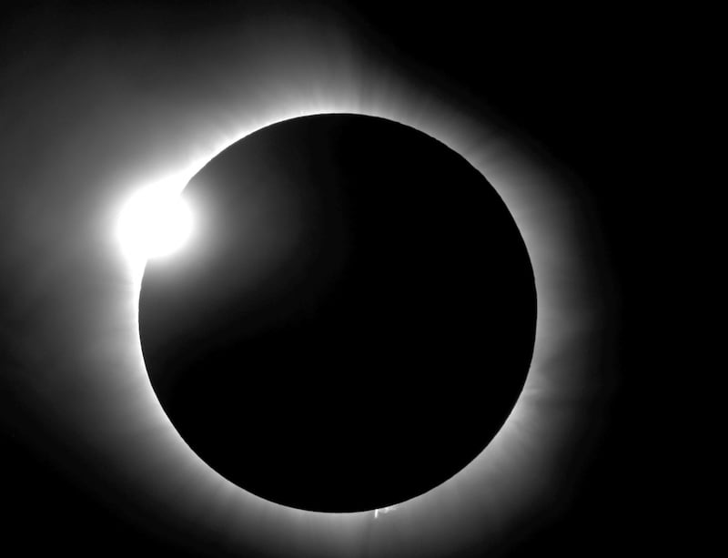 This photo provided by Bob Baer and Sarah Kovac, participants in the Citizen CATE Experiment, shows a "diamond ring" shape during the 2016 total solar eclipse in Indonesia. For the 2017 eclipse over the United States, the National Science Foundation-funded movie project nicknamed Citizen CATE will have more than 200 volunteers trained and given special small telescopes and tripods to observe the sun at 68 locations in the exact same way. The thousands of images from the citizen-scientists will be combined for a movie of the usually hard-to-see sunâ€™s edge. (R. Baer, S. Kovac/Citizen CATE Experiment via AP)