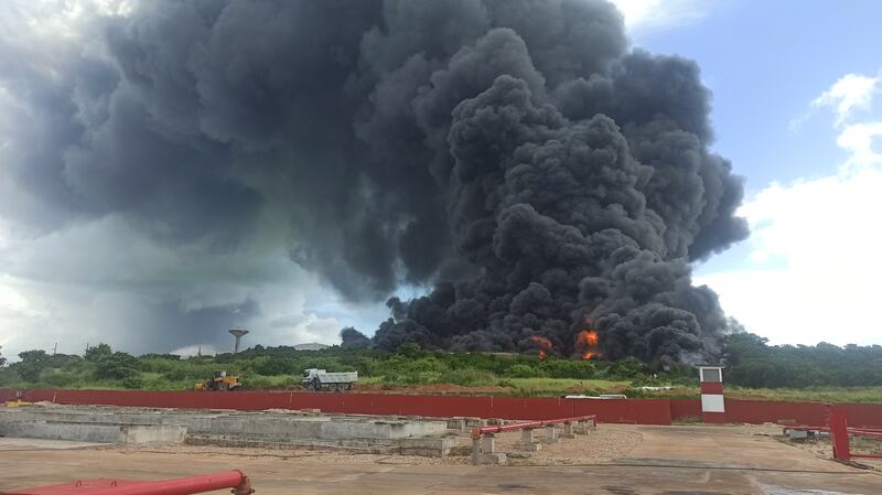 A column of smoke generated by the fire in a fuel depot in Matanzas rises into the air over western Cuba. EPA 