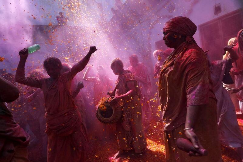 Widows daubed in colours dance as they take part in the Holi celebrations organised by non-governmental organisation Sulabh International at a widows’ ashram at Vrindavan organised by non-governmental organisation Sulabh International at a widows’ ashram at Vrindavan in the northern Indian state of Uttar Pradesh on March 5. Adnan Abidi / Reuters