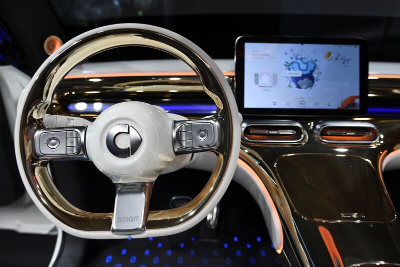 The steering wheel and display screen in the new Smart Concept #1 car. Reuters