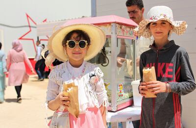 Ensam, eight, left, and Walaa, 12, get ready for their first cinema experience. Courtesy Unicef