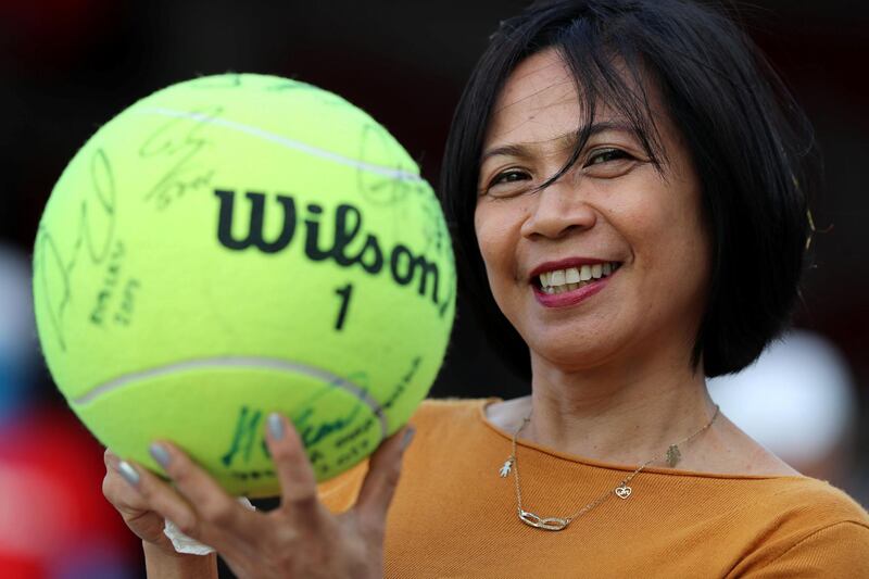 Abu Dhabi, United Arab Emirates - Reporter: Jon Turner: A tennis fan has her signed ball by lots of different players at the Mubadala World Tennis Championship. Thursday, December 19th, 2019. Zayed Sports City, Abu Dhabi. Chris Whiteoak / The National