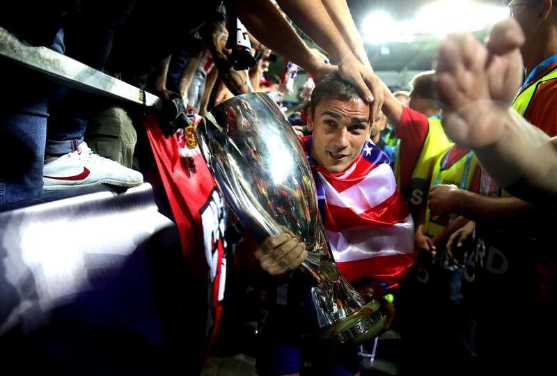 Antoine Griezmann of Atletico celebrates with the trophy. Getty