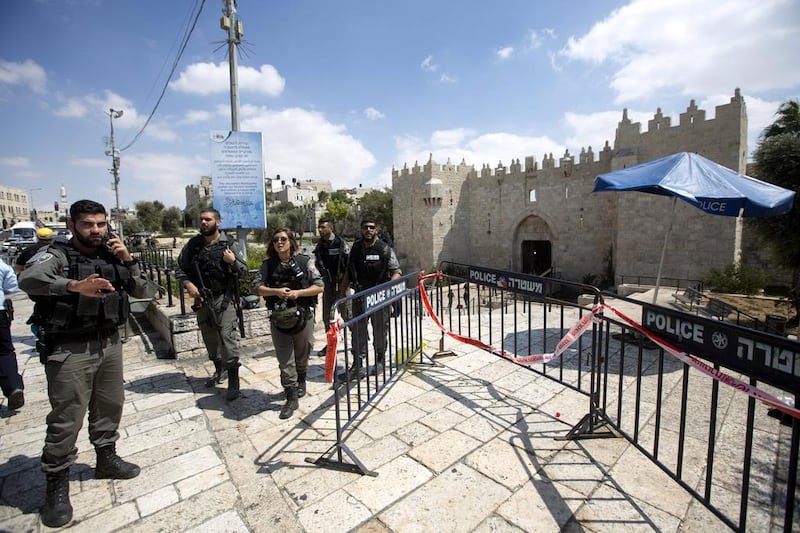Israeli Border Police surround the body of a man who allegedly attacked officers with a knife at Damascus Gate, which leads to the Muslim Quarter in the Old City of Jerusalem, Israel, on September 16, 2016. The man was a Jordanian resident with a Jordanian passport, but police are still investigating if he was also Palestinian or of Palestinian descent.  Atef Safadi / EPA