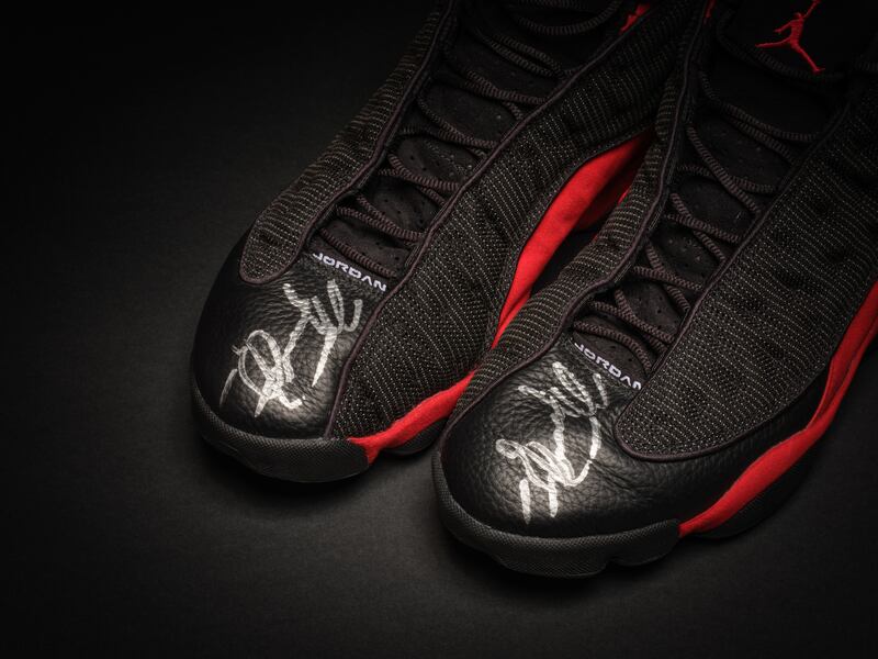 Basketball star Michael Jordan's trainers have sold at auction for more than $2.2 million. PA