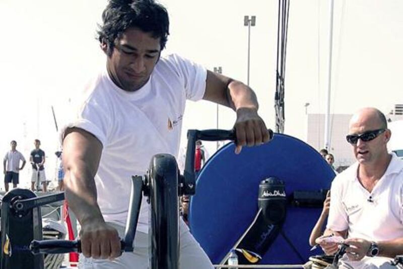 provided photo of   22-year-old Adil Khalid he is an Emirati candidate to join the  Volvo Ocean Race 2011/12 team. To the right is skipper of Abu Dhabi Ocean Racing, Ian Walker.
 Adil believes he has the experience needed to join the Abu Dhabi crew 
Courtesy ADTA