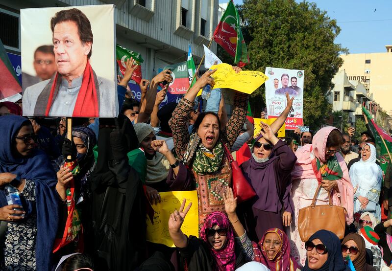 Supporters of imprisoned Pakistan's Former Prime Minister Imran Khan's and Jamaat-e-Islami party chant slogans during a protest against the delaying result of parliamentary election by Pakistan Election Commission, in Karachi. AP