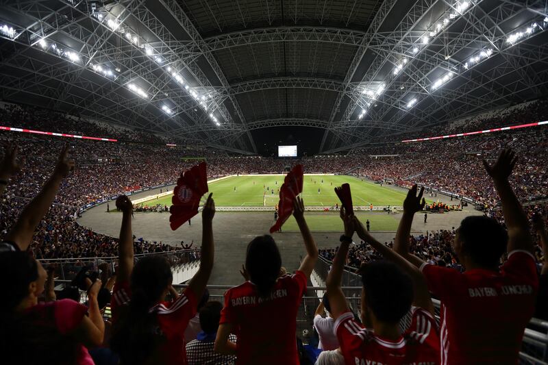 Fans celebrate a Bayern Munich goal. Suhaimi Abdullah / Getty Images