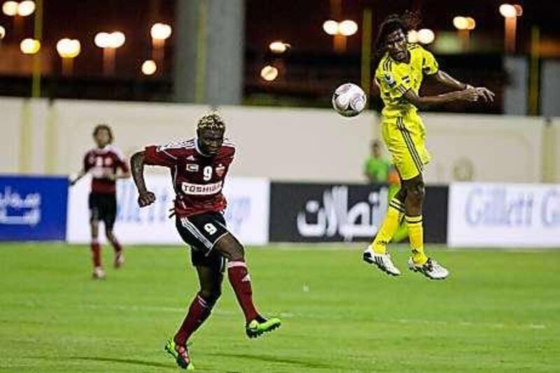 Kalba's Rashid Malullah heads the ball during the  2-2 draw with Al Ahli last night.