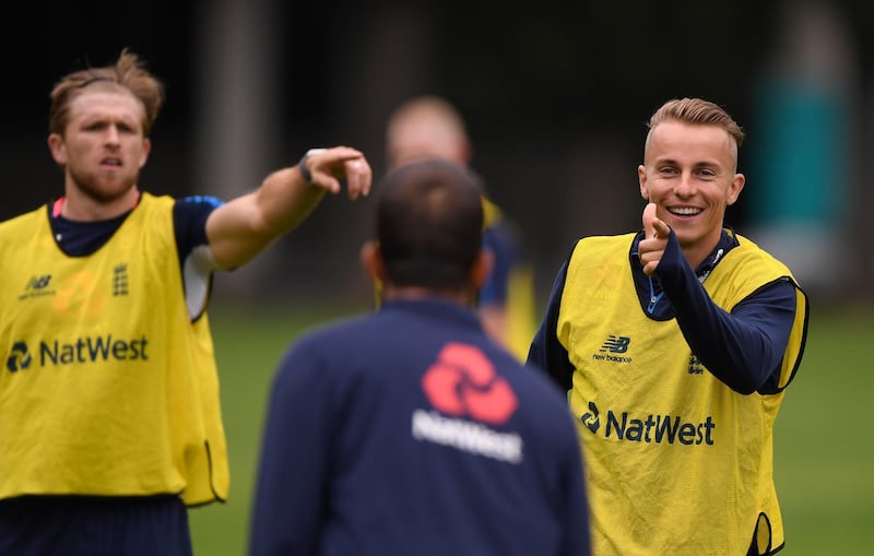 DUNEDIN, NEW ZEALAND - MARCH 6:  England player Tom Curran (r) reacts during an England training session ahead of the 4th ODI v New Zealand Black Caps at Oval on March 6, 2018 in Dunedin, New Zealand.  (Photo by Stu Forster/Getty Images)