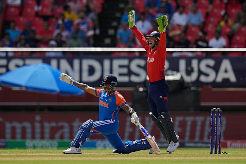 England captain Jos Buttler, right, appeals unsuccessfully for the wicket of India's Suryakumar Yadav. AFP