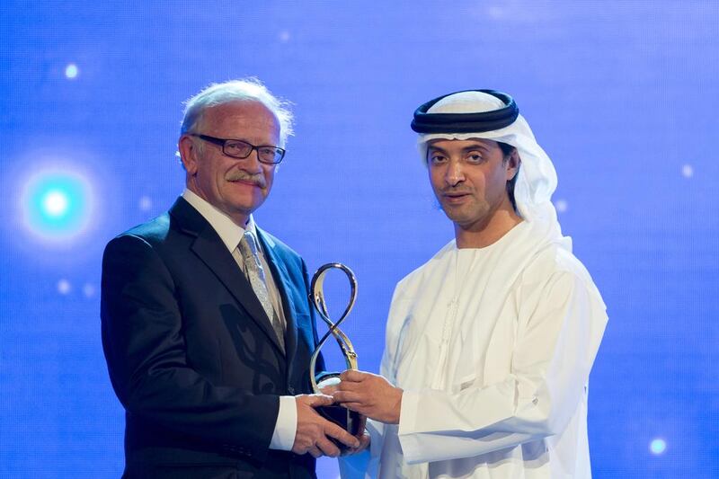Sheikh Hazza bin Zayed seen here with Peter Hellyer, a journalist and historian originally from the UK, was recognised for his contributions as a writer on the fragile ecology and rich archaeological legacy of the UAE. Mr Hellyer is also a regular columnist for The National. Ryan Carter / Crown Prince Court — Abu Dhabi