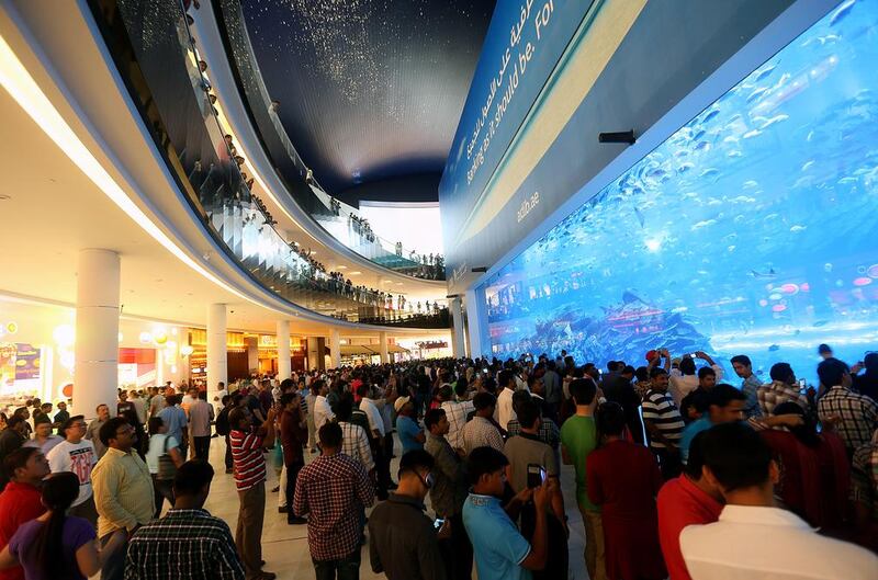 Holidaymakers and tourists pack Dubai Mall for the first day of the Eid Al Fitr break. Satish Kumar / The National 