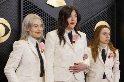Phoebe Bridgers, Lucy Dacus and Julien Baker of Boygenius wear Artists for Ceasefire pins at the 2024 Grammys. EPA