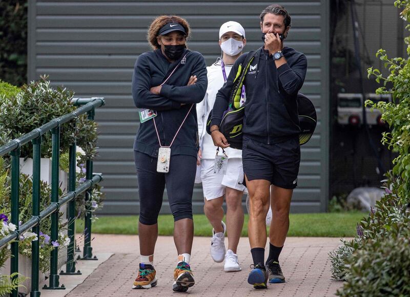 Serena Williams and coach Patrick Mouratoglou arrive for a practice session at  the All England Club, ahead of the Wimbledon Grand Slam. AFP