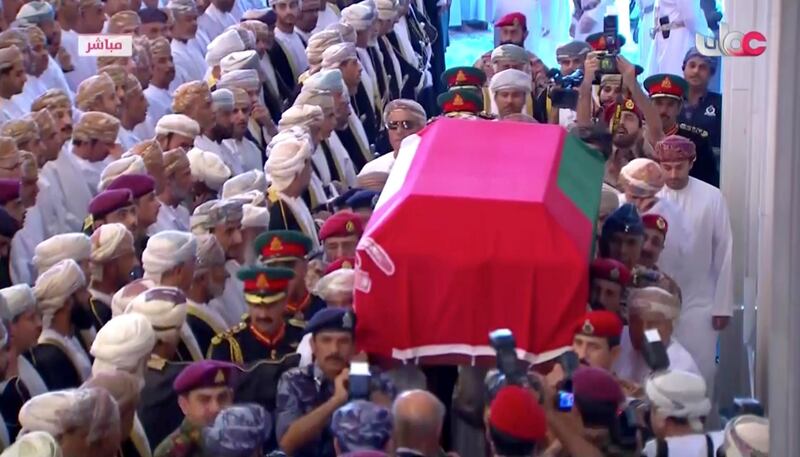 The coffin is carried to the Grand Mosque. Oman TV via AP