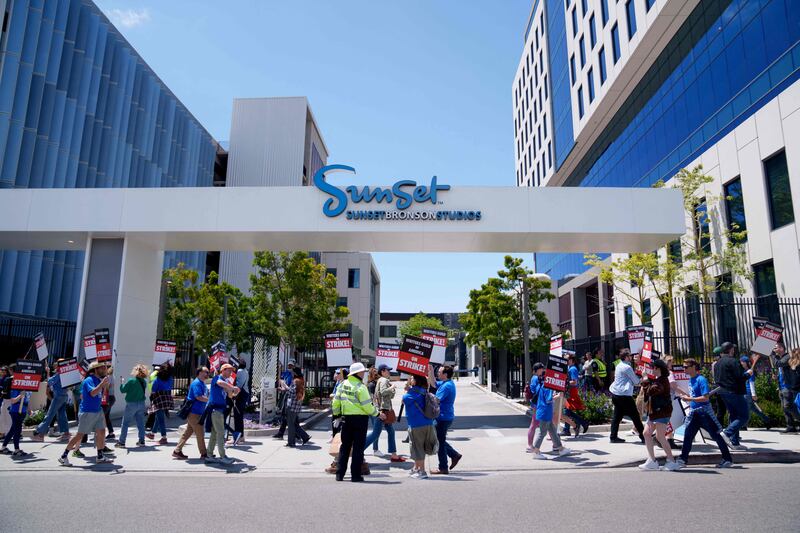 Striking Writers Guild of America workers picket outside the Sunset Bronson Studios building. AFP