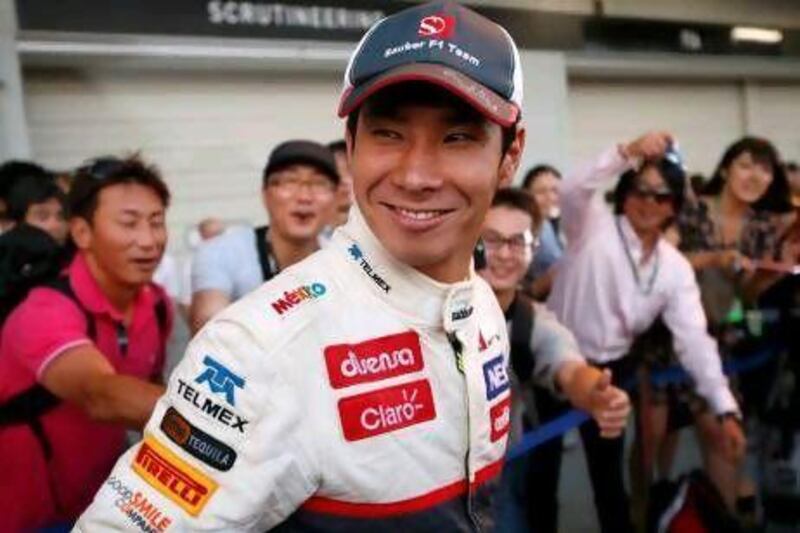 By the time Kamui Kobayashi got to the paddock to celebrate with his team plenty of fans had snuck into the area to join the celebration.