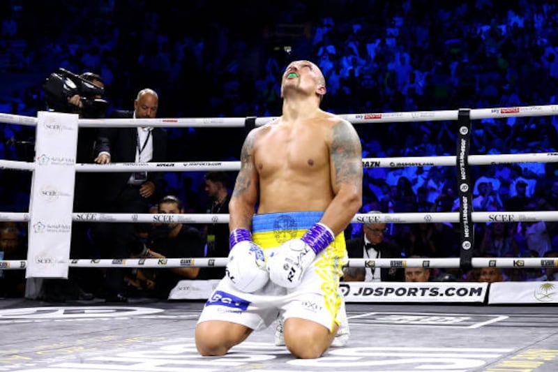 Oleksandr Usyk reacts after his victory. PA