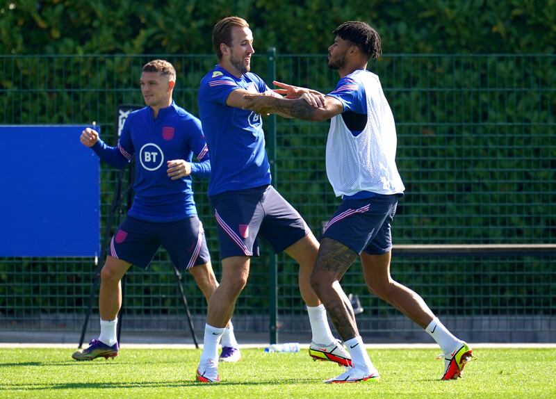 England's Tyrone Mings and Harry Kane during a training session at Hotspur Way. PA