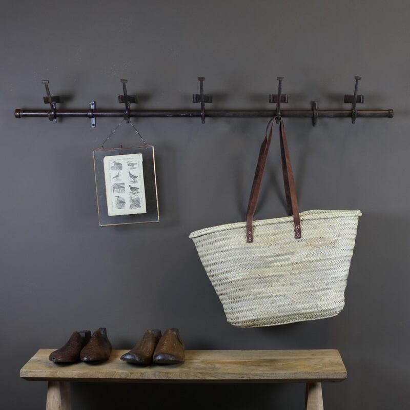 Wall-mounted hooks are key. Pallavi Dean Interiors