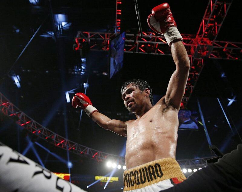 Manny Pacquiao, of the Philippines, celebrates after defeating Timothy Bradley in their fight on Saturday in Las Vegas. John Locher / AP / April 9, 2016