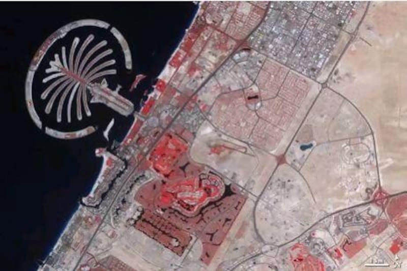 Nasa says the images are false colour, meaning bare ground appears brown and vegetation shows up as red, water is dark blue and buildings and paved surfaces are light blue or grey. Courtesy Nasa