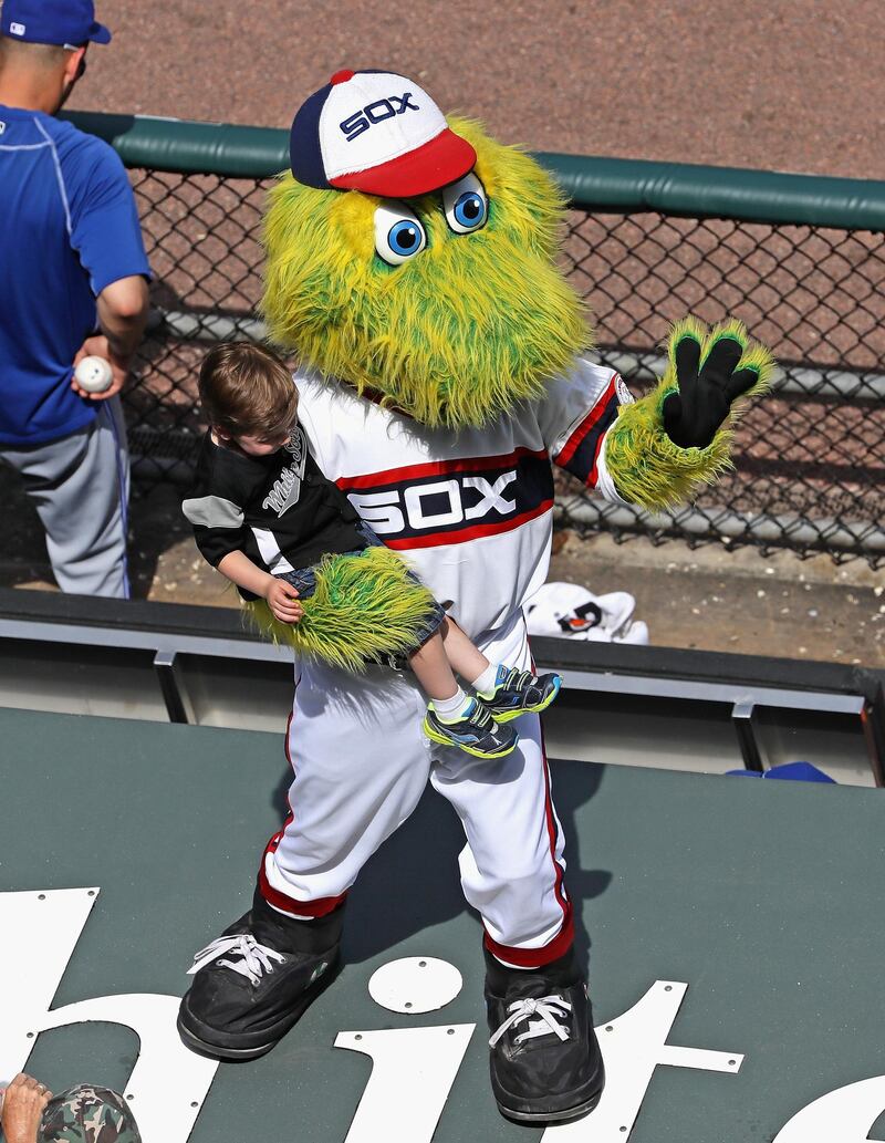 CHICAGO, IL - JUNE 26: "Southpaw," the mascot for the Chicago White Sox, holds a child during the 7th inning stretch of a game betwen the White Sox and the Toronto Blue Jays at U.S. Cellular Field on June 26, 2016 in Chicago, Illinois. The White Sox defeated the Blue Jays 5-2.   Jonathan Daniel/Getty Images/AFP