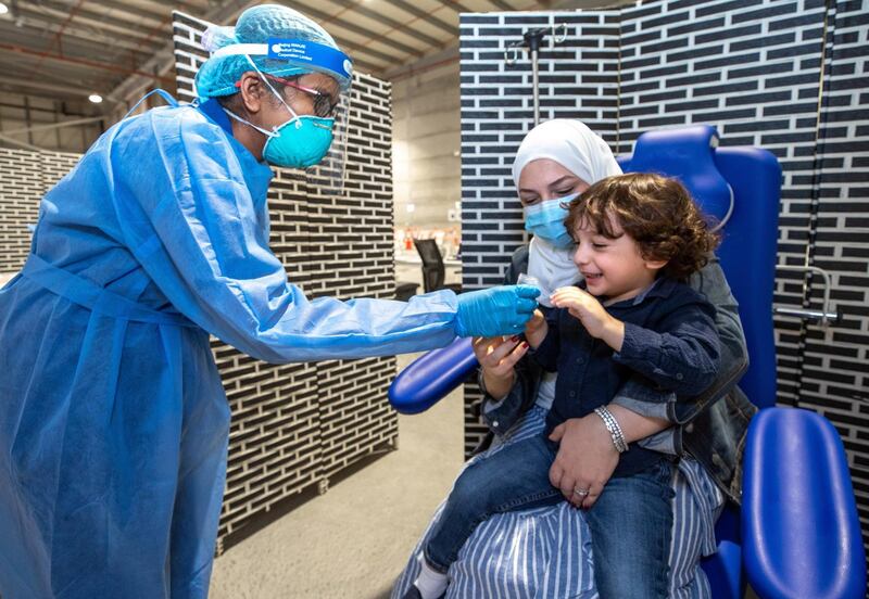 Abu Dhabi, United Arab Emirates, March 18, 2021.  Omar Al Mulla, three years old, gets saliva tested at the Biogenix lab at G42 in Masdar City.
Victor Besa/The National
Section:  NA
Reporter:  Shireena Al Nowais