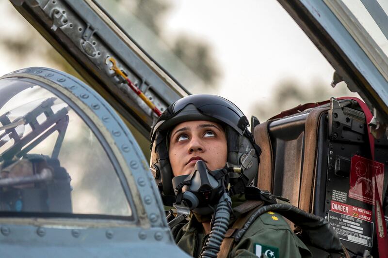 Ayesha Farooq, 26, Pakistan's only female war-ready fighter pilot, looks up as she closes the cockpit of a Chinese-made F-7PG fighter jet at Mushaf base in Sargodha, north Pakistan June 6, 2013. Farooq, from Punjab province's historic city of Bahawalpur, is one of 19 women who have become pilots in the Pakistan Air Force over the last decade - there are five other female fighter pilots, but they have yet to take the final tests to qualify for combat. A growing number of women have joined Pakistan's defence forces in recent years as attitudes towards women change. Picture taken June 6, 2013. REUTERS/Zohra Bensemra (PAKISTAN - Tags: MILITARY SOCIETY) *** Local Caption ***  ZOH09_PAKISTAN-AIRF_0612_11.JPG