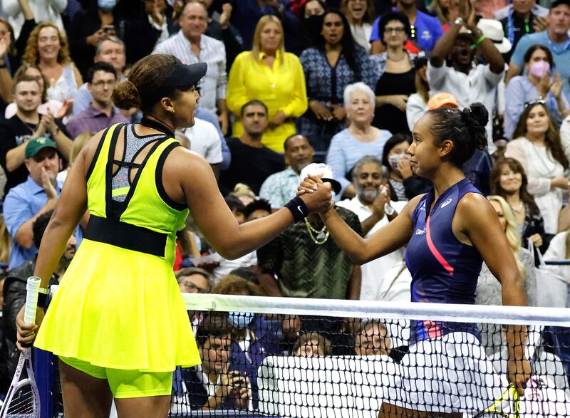 Leylah Fernandez of Canada shakes hands with Naomi Osaka. EPA