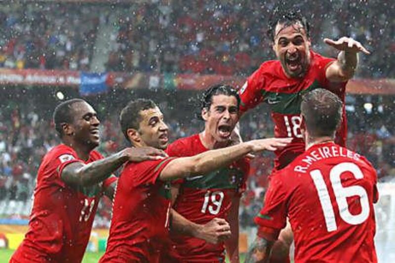 Portugal celebrate opening the scoring against North Korea. They went on to celebrate another six goals.