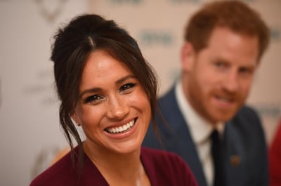 (FILES) In this file photo taken on October 25, 2019 Britain's Prince Harry, Duke of Sussex (R) and Meghan, Duchess of Sussex attend a roundtable discussion on gender equality with The Queen’s Commonwealth Trust (QCT) and One Young World at Windsor Castle in Windsor.  Prince Harry's wife Meghan has returned to Canada following the couple's bombshell announcement that they were quitting their frontline royal duties, their spokeswoman said on January 10, 2020. The Duke and Duchess of Sussex spent an extended Christmas break in Canada with their baby son Archie, before returning to break the news that they wanted to "step back" from their roles as senior members of the Royal family. / AFP / POOL / Jeremy Selwyn
