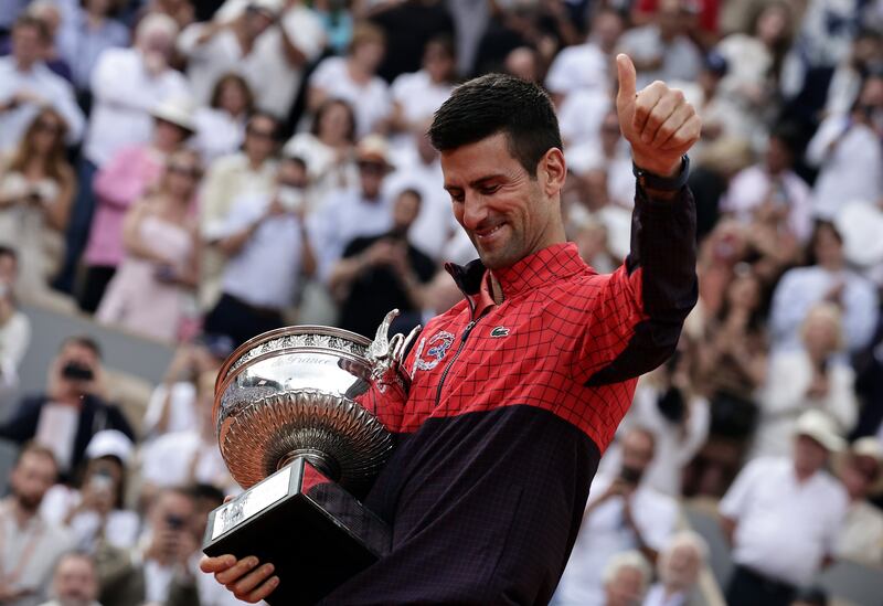 Novak Djokovic celebrates after beating Casper Ruud in the French Open final at Roland Garros on June 11, 2023. EPA