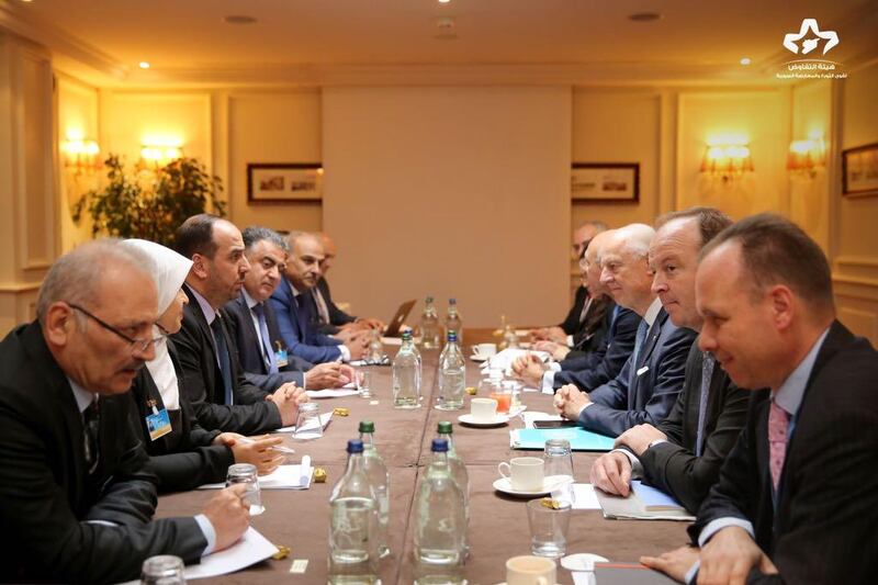 Members of the unified Syrian opposition delegation meet with UN officials in Geneva on November 29, 2017 on the first day of the eighth round of UN-brokered peace talks. High Negotiations Committee