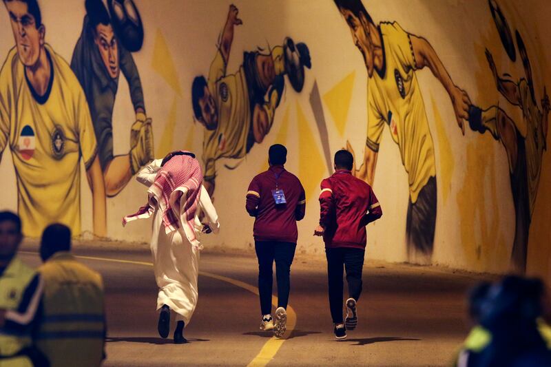 In this photo provided by Iranian Students' News Agency, ISNA, members of Saudi Arabia's Al Ittihad team leave Naghsh-e-Jahan stadium in the central city of Isfahan, Iran after the Saudi club refused to play because of the presence of a statue of a slain Iranian general Qassem Soleimani placed on the sideline, Saudi state media reported. AP