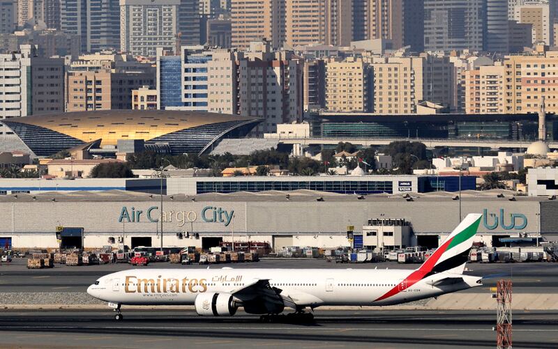 An Emirates aircraft at Dubai International Airport. The airline has benefitted from a rebound in travel demand and a strong cargo performance. AFP