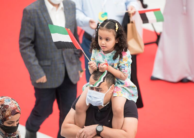 A girl celebrating Flag Day with her father at the SIBF.  Ruel Pableo / The National