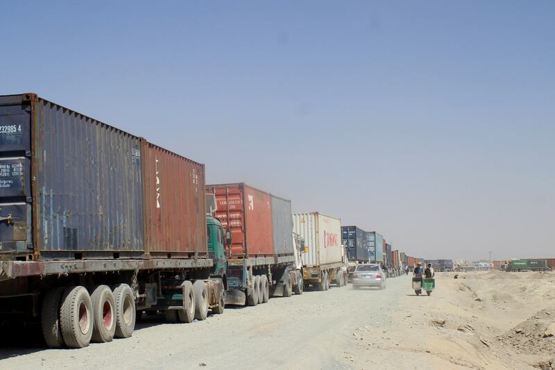 Vehicles loaded with shipping containers wait to cross into Afghanistan,  at the Friendship Gate crossing point, in the border town of Chaman, Pakistan. Reuters