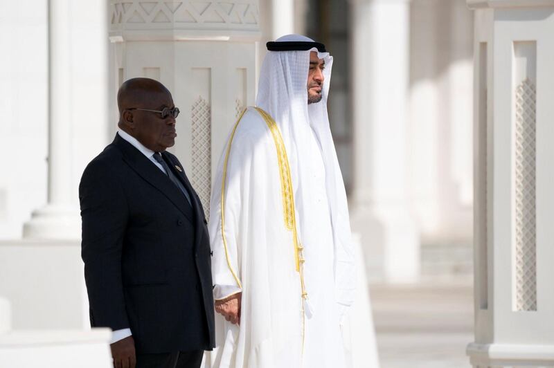 Sheikh Mohamed bin Zayed, Crown Prince of Abu Dhabi and Deputy Supreme Commander of the UAE Armed Forces, and President Nana Akufo-Addo of Ghana hear the national anthems of their respective countries before their meeting at Qasr Al Watan. Courtesy Ministry of Presidential Affairs